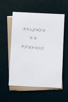A simple card displaying the message 'Balance or Burnout' emphasizing mental health and stress management.
